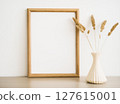 Dried flowers in a vase with a wooden frame 127615001
