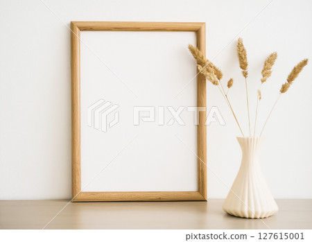 Dried flowers in a vase with a wooden frame 127615001