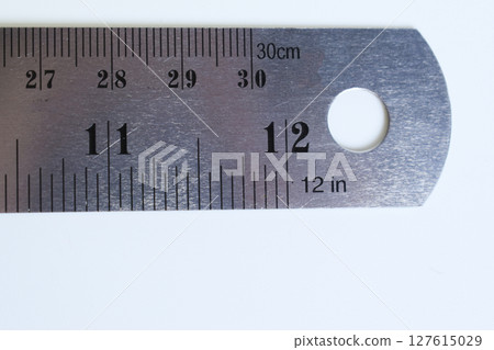 metal ruler isolated on white background, object for education metal ruler isolated on white background, object for education 127615029