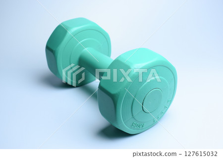single green dumbbell on white background, object for exercise single green dumbbell on white background, object for exercise 127615032