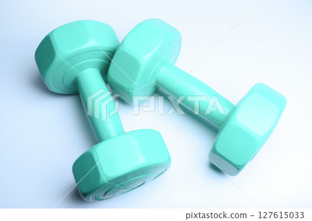 two green dumbbell on white background, object for exercise two green dumbbell on white background, object for exercise 127615033