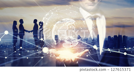 Collage of a group of business people shaking hands and a global network. Horizontal image for banners and advertisements. 127615371