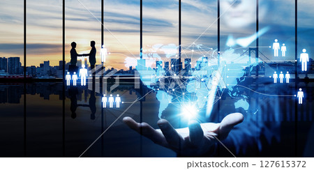 Collage of a group of business people shaking hands and a global network. Horizontal image for banners and advertisements. 127615372