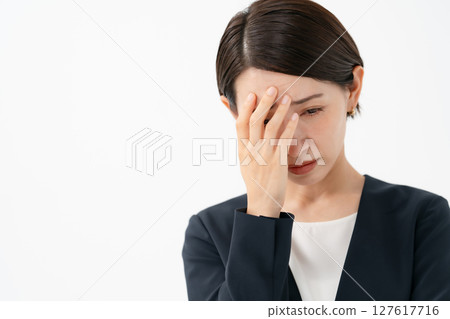 A worried woman hiding her eyes A worried woman hiding her eyes 127617716