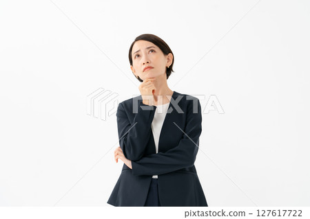 A woman in a suit to think 127617722
