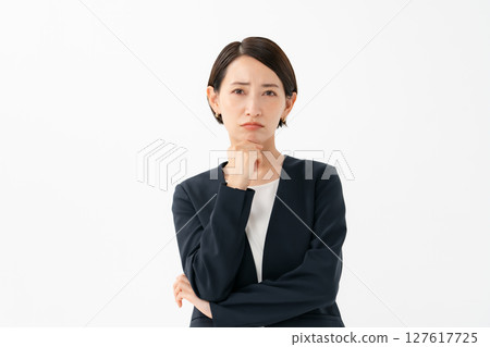 A woman in a suit to think 127617725