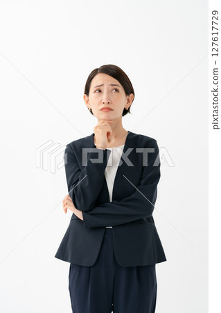 A woman in a suit to think A woman in a suit to think 127617729
