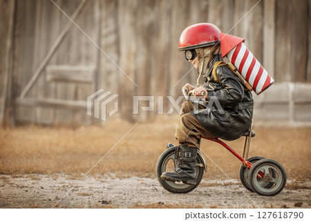 Boy play in the rider and the rocketman Boy play in the rider and the rocketman 127618790