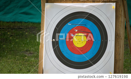 Close-Up of Archery Target Practice with Arrows in Bullseye Close-Up of Archery Target Practice with Arrows in Bullseye 127619198