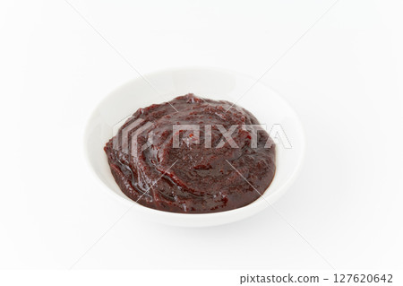 Gochujang in a small dish on a white background 127620642