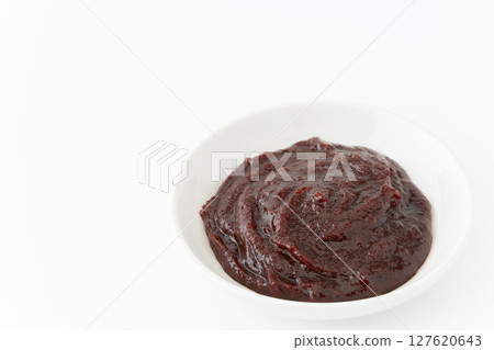 Gochujang in a small dish on a white background 127620643