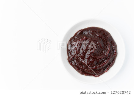 Gochujang in a small dish on a white background Gochujang in a small dish on a white background 127620742