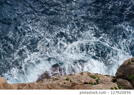 Majestic Ocean Waves Crashing Against Rocky Cliffs A Stunning Coastal Landscape View 127620856