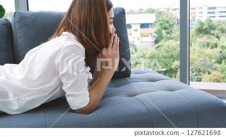 Smiling face asian woman holding smartphone with E-commerce Shopping online website Reading Online Article, Blog, vlog. Young Woman hands holding phone technology lifestyle. Woman using smart phone. Smiling face asian woman holding smartphone with E-commerce Shopping online website Reading Online Article, Blog, vlog. Young Woman hands holding phone technology lifestyle. Woman using smart phone. 127621698