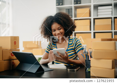 Successful African Successful African Businesswoman Analyzing Finance on Tablet and Laptop at modern Office Desk tax, Analyzing Finance on Tablet and Laptop at modern Office Desk tax, 127621955