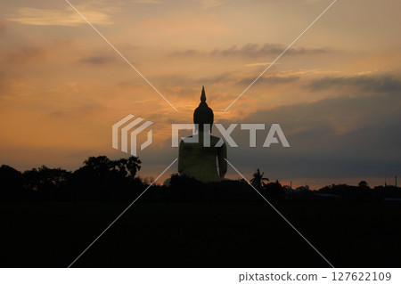 The largest golden Buddha statue with green rice field foreground at Wat Muang Temple in Ang Thong Province, Thailand. 127622109
