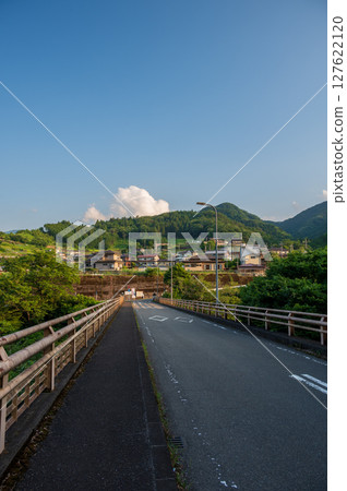 Akiyama Village at dusk, a peaceful rural landscape, Akiyama Bridge 127622120