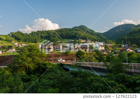 Akiyama Village at dusk, a peaceful rural landscape, Akiyama Bridge 127622123