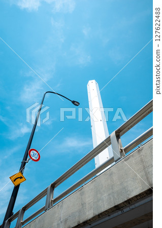 Looking up at street lights and tall chimneys a-3 light color 127622488