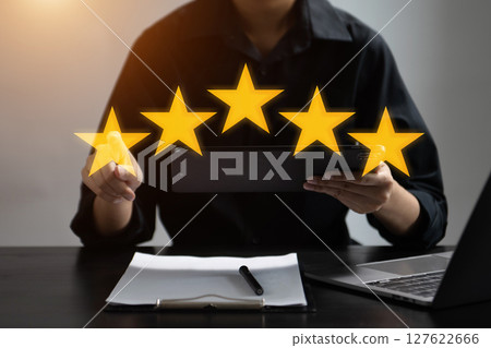Customer or client the stars to complete five stars. with copy space. giving a five star rating. Service rating, satisfaction concept. Customer or client the stars to complete five stars. with copy space. giving a five star rating. Service rating, satisfaction concept. 127622666