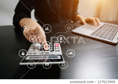 Business report, analysis and planning, Business hand pointing at business document and a tablet, smartphone and laptop displaying financial data with virtual icon Business report, analysis and planning, Business hand pointing at business document and a tablet, smartphone and laptop displaying financial data with virtual icon 127622668