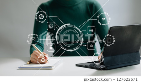 Business report, analysis and planning, Business hand pointing at business document and a tablet, smartphone and laptop displaying financial data with virtual icon Business report, analysis and planning, Business hand pointing at business document and a tablet, smartphone and laptop displaying financial data with virtual icon 127622671