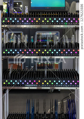 Automated industrial storage system with green light, Smart warehouse automation modern storage and retrieval system, Industry 4.0 automated robotic storage warehouse. Automated industrial storage system with green light, Smart warehouse automation modern storage and retrieval system, Industry 4.0 automated robotic storage warehouse. 127622886