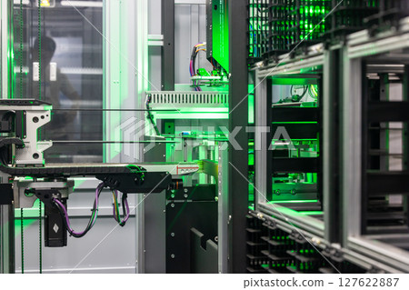 Automated industrial storage system with green light, Smart warehouse automation modern storage and retrieval system, Industry 4.0 automated robotic storage warehouse. Automated industrial storage system with green light, Smart warehouse automation modern storage and retrieval system, Industry 4.0 automated robotic storage warehouse. 127622887