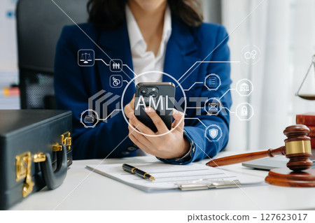 AML Anti Money Laundering Financial Bank Business Concept. judge in a courtroom using laptop and tablet with AML anti money laundering icon on virtual AML Anti Money Laundering Financial Bank Business Concept. judge in a courtroom using laptop and tablet with AML anti money laundering icon on virtual 127623017