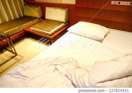 Messy hotel bed at checkout Messy hotel bed at checkout 127624331
