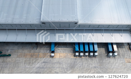 Aerial view semi truck cargo trailer at logistic park warehouse goods, Distribution warehouse shipping supply chain, Business transportation logistic freight shipping cargo by semi truck cargo trailer 127624720