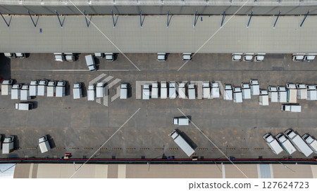 Aerial view semi truck cargo trailer at logistic park warehouse goods, Distribution warehouse shipping supply chain, Business transportation logistic freight shipping cargo by semi truck cargo trailer 127624723