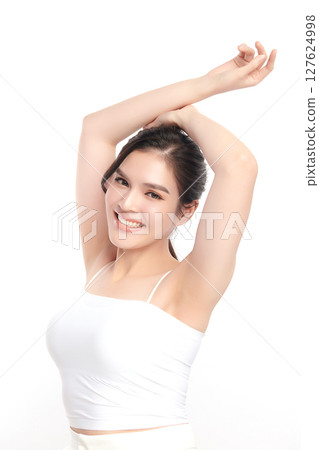 Beautiful Young Asian woman Raises her hands to Showcase clean and hygienic underarms Against a white background, Smooth armpit cleanliness and protection concept Beautiful Young Asian woman Raises her hands to Showcase clean and hygienic underarms Against a white background, Smooth armpit cleanliness and protection concept 127624998