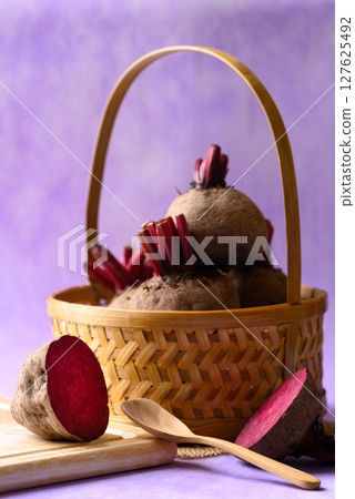 Fresh beetroot in basket on purple background, Organic vegetable 127625492