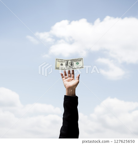 Businessman's hands and dollars 127625650