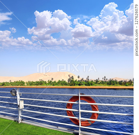View from cruise ship on the Nile river, Egypt, Africa. Luxury Nile Cruise. Famous tourist attraction. Summer relaxing on cruise ships. Topic of travel, trip abroad on vacation, cruises and tours 127626079