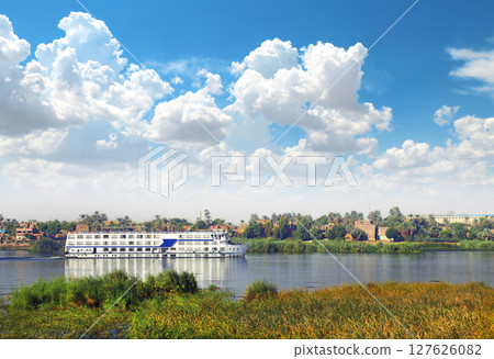 View from cruise ship on the Nile river, Egypt, Africa. Famous tourist attraction. Summer relaxing on cruise ships. Topic of travel, trip abroad on vacation, cruises and tours 127626082