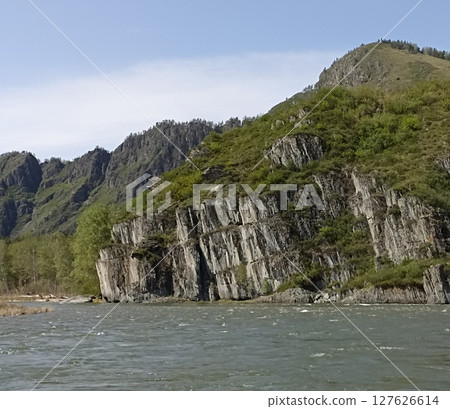 Majestic Mountain Landscape with River, Rocks, and Lush Greenery, Perfect for Outdoor Adventures 127626614