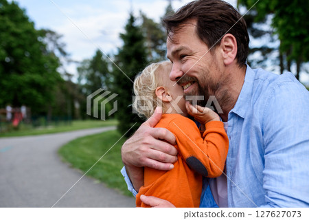 Portrait of dad and child enjoying time together Portrait of dad and child enjoying time together 127627073