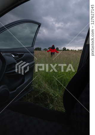 Person in Red Jacket Standing in Field Person in Red Jacket Standing in Field 127627145