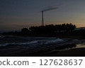 Silhouette of Telecommunication Tower and Coconut Tree on the Beach at Dusk 127628637