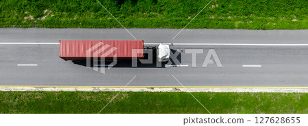 Aerial view cargo truck on highway logistic cargo transport, Semi truck trailer on highway cargo transport supply chain freight distrtibution, Global business logistic transport truck cargo freight. Aerial view cargo truck on highway logistic cargo transport, Semi truck trailer on highway cargo transport supply chain freight distrtibution, Global business logistic transport truck cargo freight. 127628655