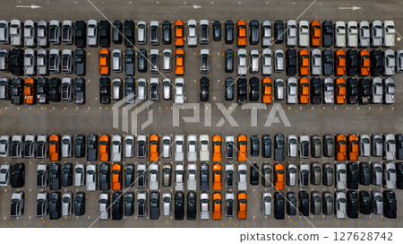 Aerial view vehicle stockyard with new cars pickup truck parked in row, Automotive industry logistic and distribution, New cars for import export tansportation logistic, New cars line up. 127628742