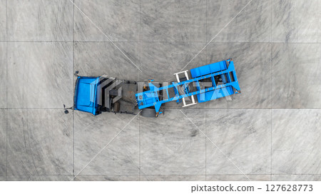 Aerial view semi truck cargo trailer at logistic park warehouse goods, Distribution warehouse shipping supply chain, Business transportation logistic freight shipping cargo by semi truck cargo trailer Aerial view semi truck cargo trailer at logistic park warehouse goods, Distribution warehouse shipping supply chain, Business transportation logistic freight shipping cargo by semi truck cargo trailer 127628773