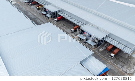 Aerial view semi truck cargo trailer at logistic park warehouse goods, Distribution warehouse shipping supply chain, Business transportation logistic freight shipping cargo by semi truck cargo trailer Aerial view semi truck cargo trailer at logistic park warehouse goods, Distribution warehouse shipping supply chain, Business transportation logistic freight shipping cargo by semi truck cargo trailer 127628815