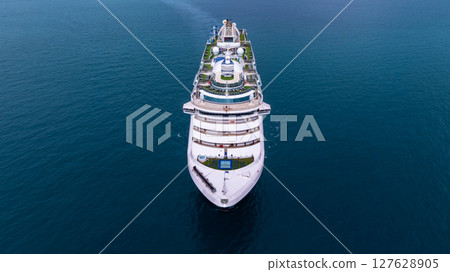 Aerial view luxury ocean cruise ship on clam blue sea, Elegant modern travel lifestyle, Luxury cruise ship liner modern maritime business ocean tourism, Global business cruise ship liner industry. 127628905