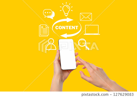 Person interacts with a smartphone while exploring diverse digital content options Person interacts with a smartphone while exploring diverse digital content options 127629083