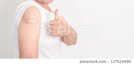 Elderly Woman with bandage after received vaccine. Vaccination and Immunization for Influenza, Herpes Zoster, Tetanus, Covid 19 booster, Dengue, Encephalitis, Rabies, Pneumococcal, IPD, RSV Vaccines Elderly Woman with bandage after received vaccine. Vaccination and Immunization for Influenza, Herpes Zoster, Tetanus, Covid 19 booster, Dengue, Encephalitis, Rabies, Pneumococcal, IPD, RSV Vaccines 127629490