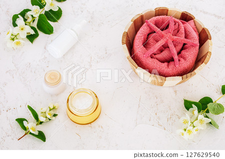 Spa products for facial and body care with soft terry towel. Spa products for facial and body care with soft terry towel. 127629540