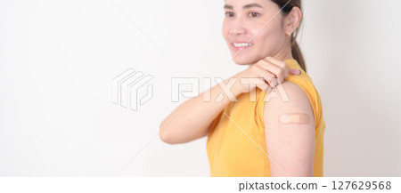 Adult Woman with bandage after received vaccine. Vaccination and Immunization for Influenza, HPV, Zoster, IPD, DTP or Diphtheria, Tetanus and Pertussis, MMR, Hepatitis B, Covid and Varicella vaccine Adult Woman with bandage after received vaccine. Vaccination and Immunization for Influenza, HPV, Zoster, IPD, DTP or Diphtheria, Tetanus and Pertussis, MMR, Hepatitis B, Covid and Varicella vaccine 127629568